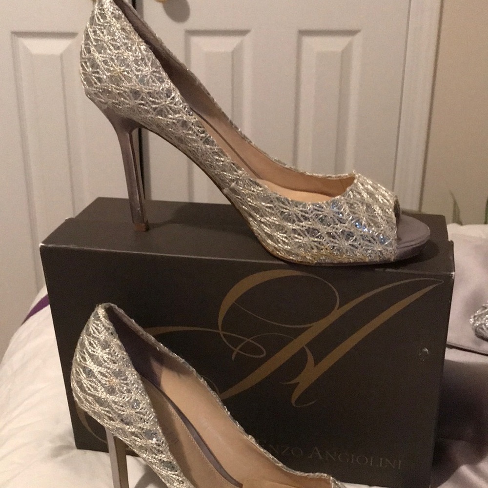 Enzo Angiolini Silver peep toe heels.
